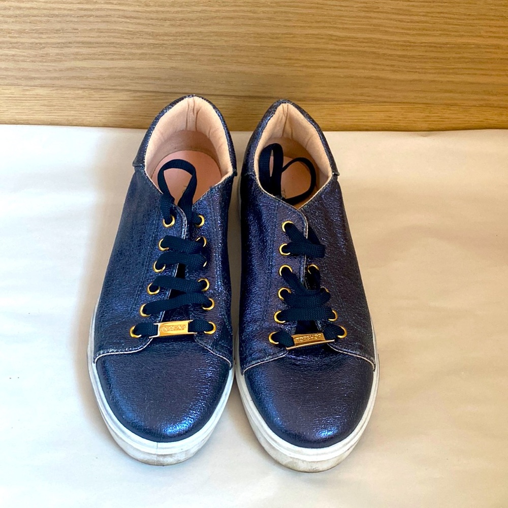 Navy, slightly sparkly Italian sneakers.
